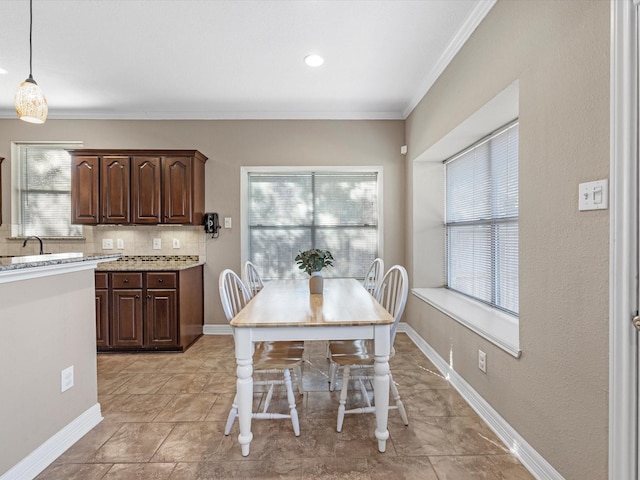 unfurnished dining area featuring crown molding