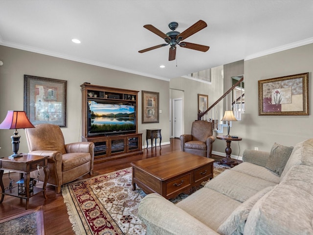 living room featuring hardwood / wood-style flooring, ceiling fan, and crown molding