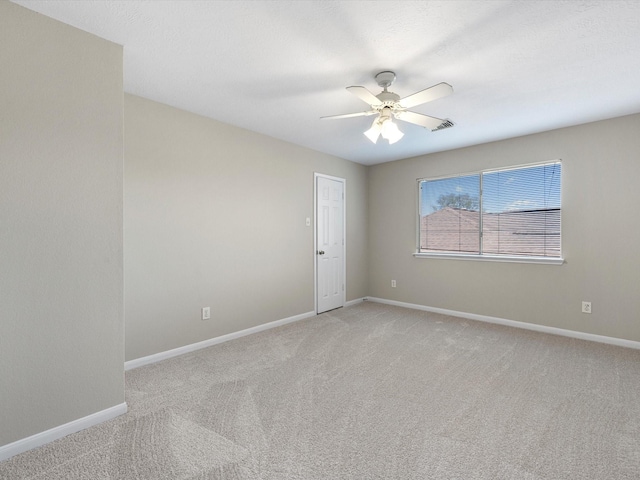 carpeted empty room with ceiling fan