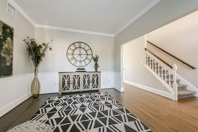 interior space with dark wood-type flooring and ornamental molding