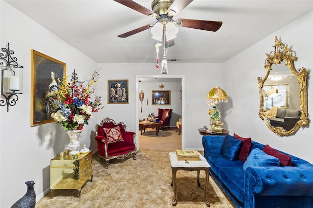 carpeted living room featuring ceiling fan