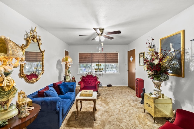 living room with ceiling fan and carpet floors