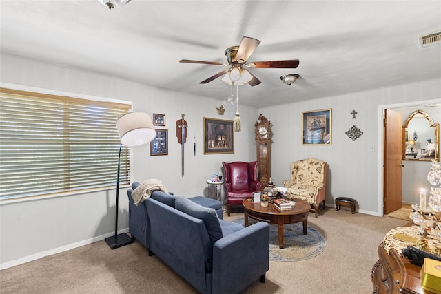 living room featuring ceiling fan and carpet floors