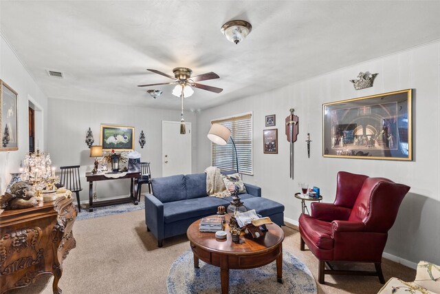 carpeted living room with ceiling fan