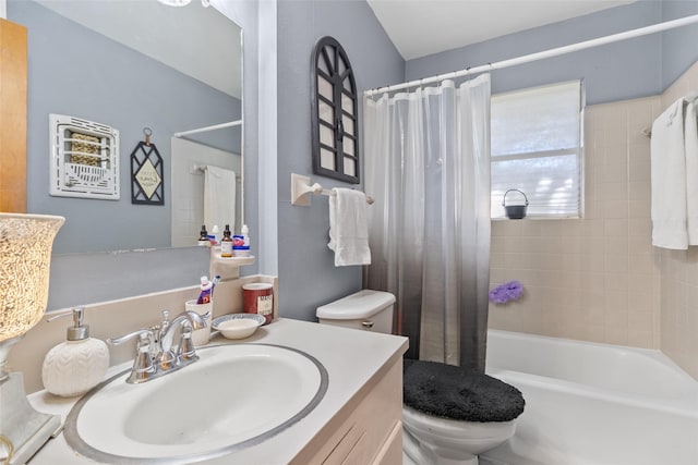 full bathroom featuring shower / tub combo with curtain, vanity, and toilet