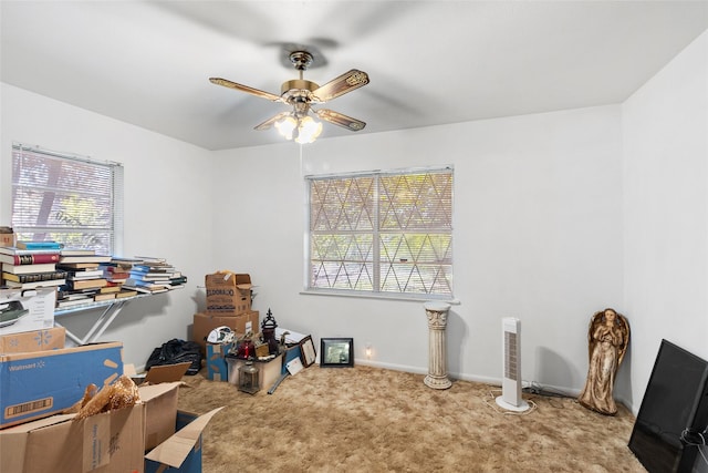 interior space with ceiling fan