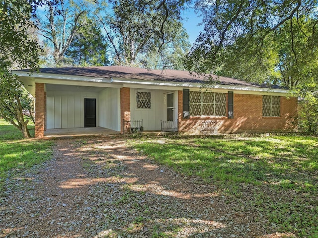 back of house with a lawn