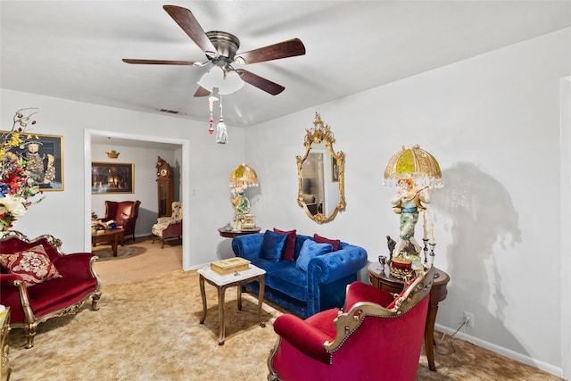 living room with carpet flooring and ceiling fan