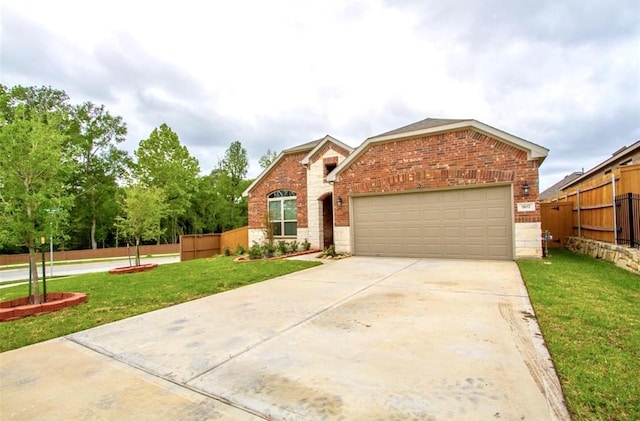 view of front of home with concrete driveway, brick siding, and a front yard