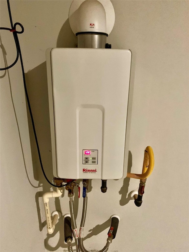 utility room with water heater