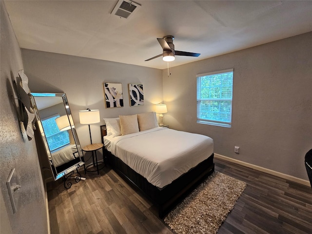 bedroom featuring dark hardwood / wood-style flooring and ceiling fan