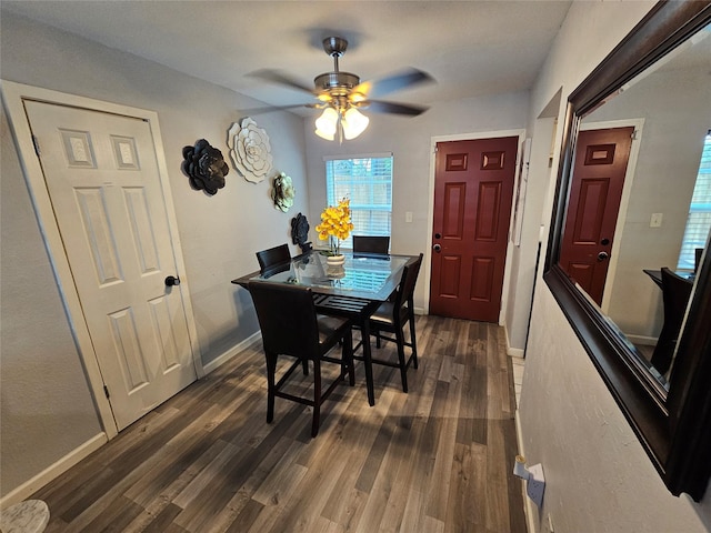 7886 Hamlet St, Houston, TX 77078 - dining area with a ceiling fan, dark wood-style flooring, and baseboards