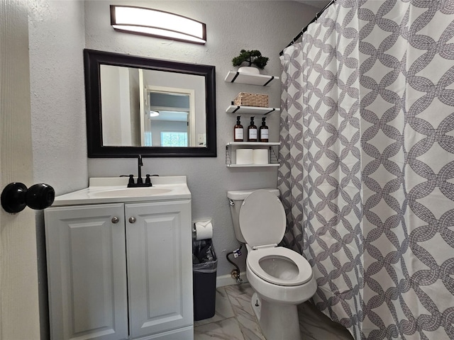 7886 Hamlet St, Houston, TX 77078 - full bath with a textured wall, toilet, vanity, marble finish flooring, and a shower with shower curtain