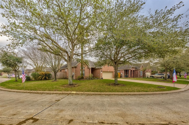 view of front of property with a front lawn and a garage