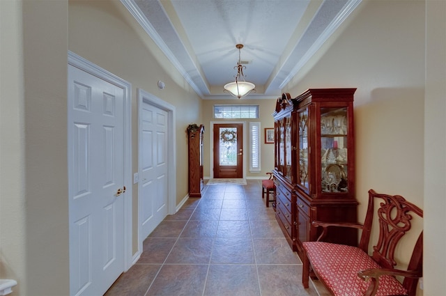 entryway featuring dark tile patterned floors