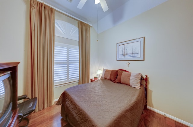 bedroom with ceiling fan and wood-type flooring