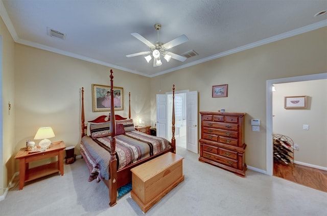 bedroom with ceiling fan, crown molding, and light carpet