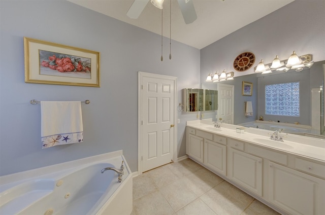 bathroom featuring tile patterned floors, vanity, ceiling fan, and a tub