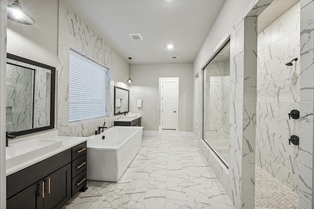 bathroom featuring vanity and separate shower and tub