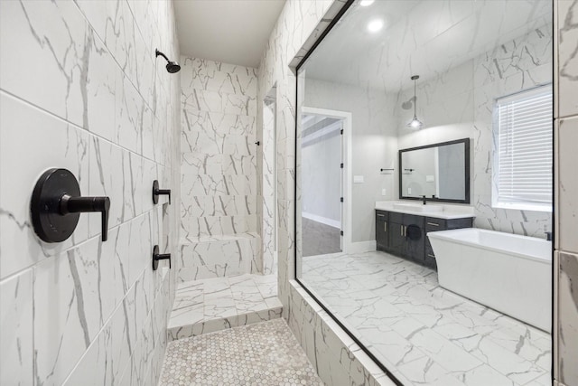 bathroom featuring separate shower and tub and vanity