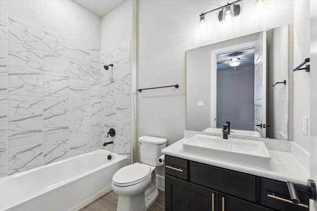 full bathroom with vanity, toilet, and tiled shower / bath