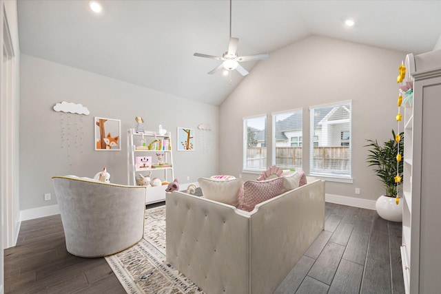 living room featuring dark hardwood / wood-style floors, ceiling fan, and high vaulted ceiling