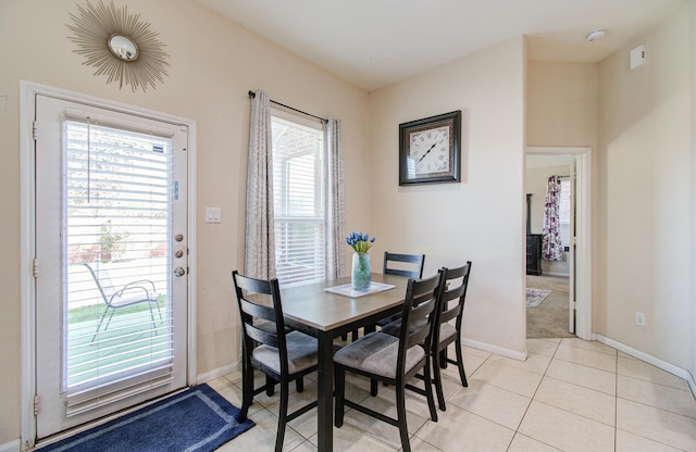 dining room featuring light tile patterned floors