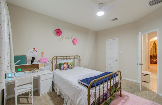 bedroom with ensuite bath, ceiling fan, and light colored carpet