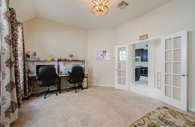 office space with french doors, light colored carpet, an inviting chandelier, and lofted ceiling