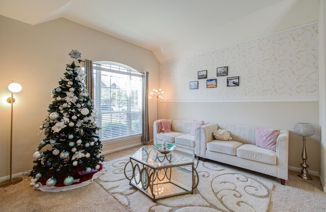 living room featuring carpet and lofted ceiling