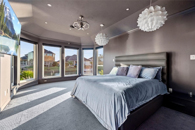 carpeted bedroom featuring a notable chandelier, lofted ceiling, and ornamental molding