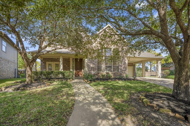 view of front of property with brick siding, fence, and a front lawn