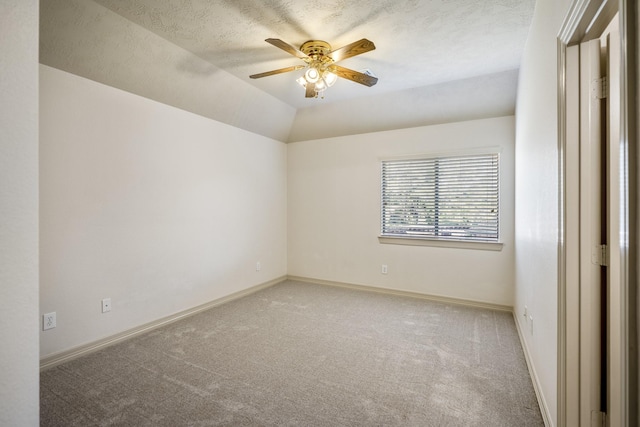 spare room featuring ceiling fan, carpet floors, and baseboards