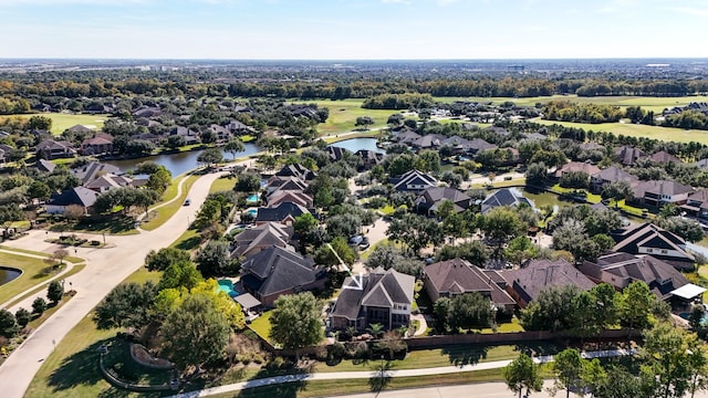 bird's eye view with a water view and a residential view