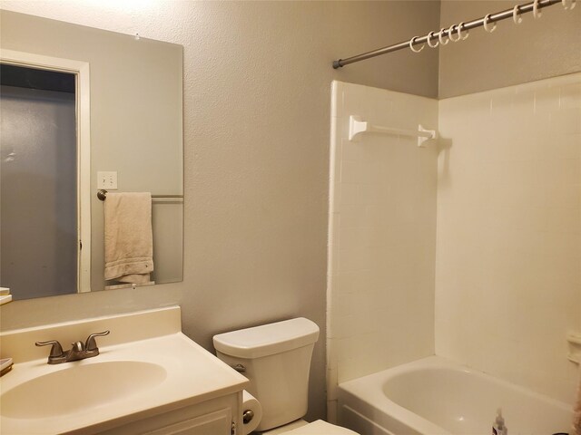 full bathroom featuring vanity, shower / bath combination, and toilet