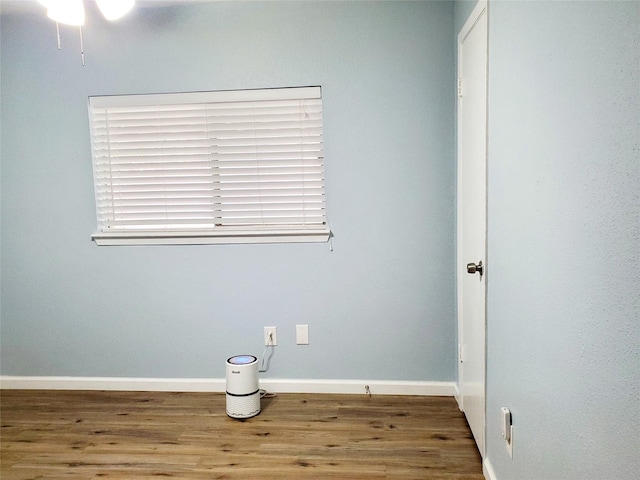 empty room with hardwood / wood-style flooring