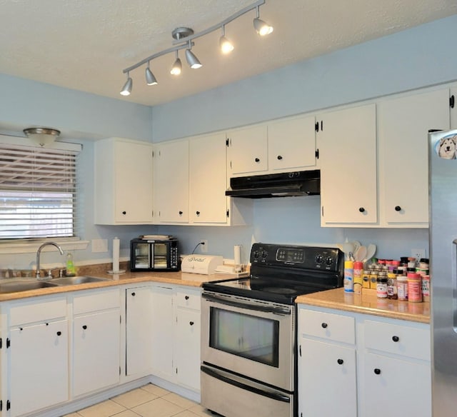 kitchen featuring a textured ceiling, white cabinetry, sink, and appliances with stainless steel finishes