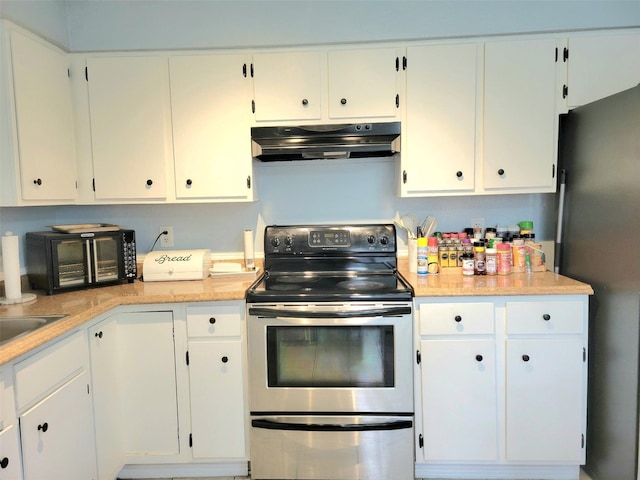 kitchen with white cabinetry and stainless steel electric range oven