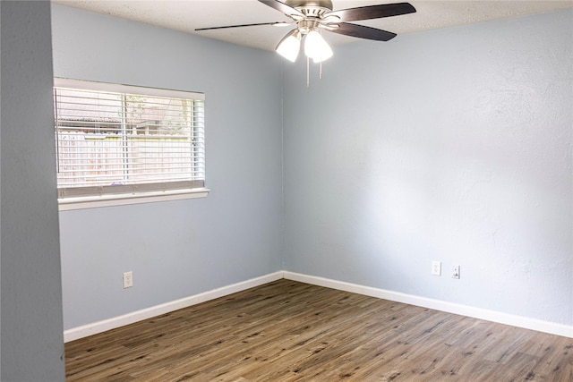 4507 Adonis Dr, Spring, TX 77373 - spare room with wood finished floors, ceiling fan, and baseboards