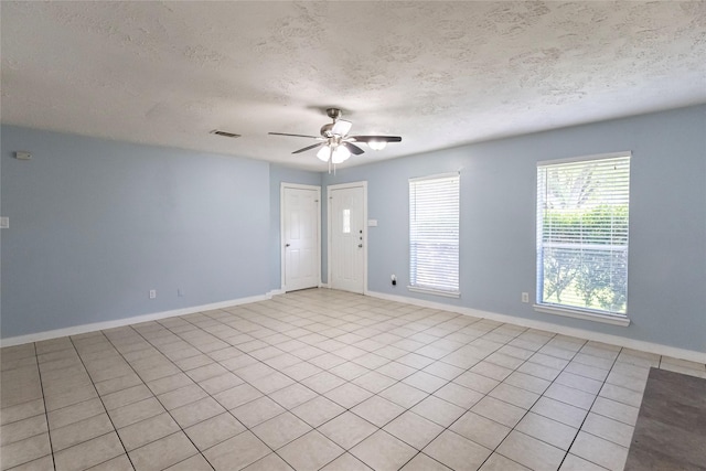4507 Adonis Dr, Spring, TX 77373 - empty room featuring a textured ceiling, a ceiling fan, and baseboards