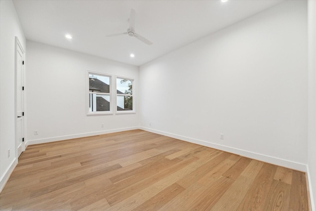 unfurnished room featuring ceiling fan and light hardwood / wood-style floors