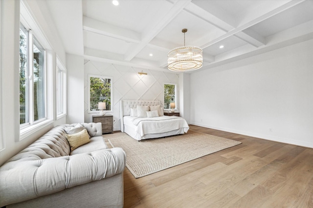 bedroom featuring hardwood / wood-style floors, beamed ceiling, coffered ceiling, and a notable chandelier