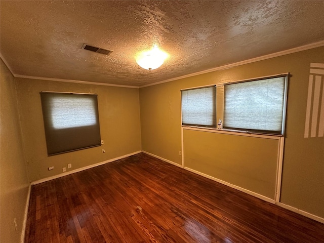 unfurnished room with a textured ceiling, crown molding, and dark wood-type flooring