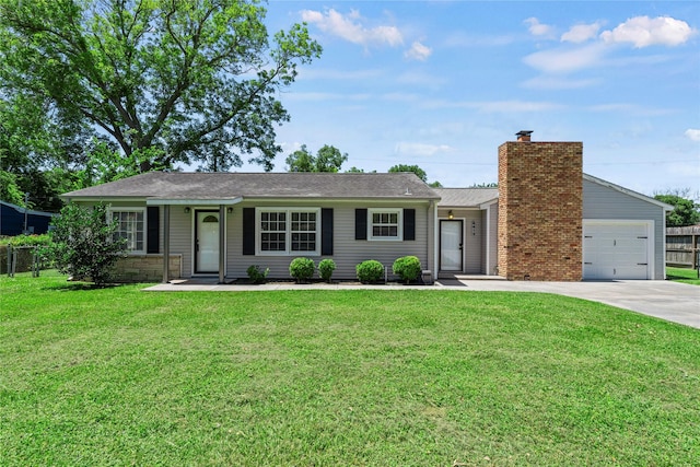 single story home with a garage and a front lawn