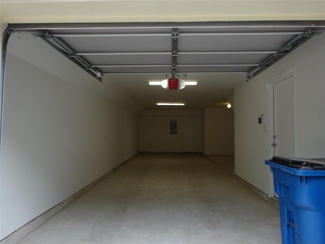 garage featuring a garage door opener and electric panel