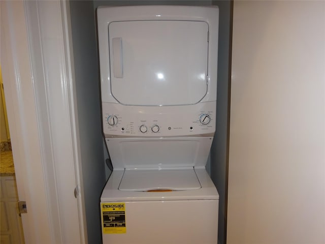 washroom featuring stacked washer / dryer