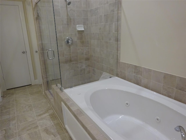 bathroom with shower with separate bathtub