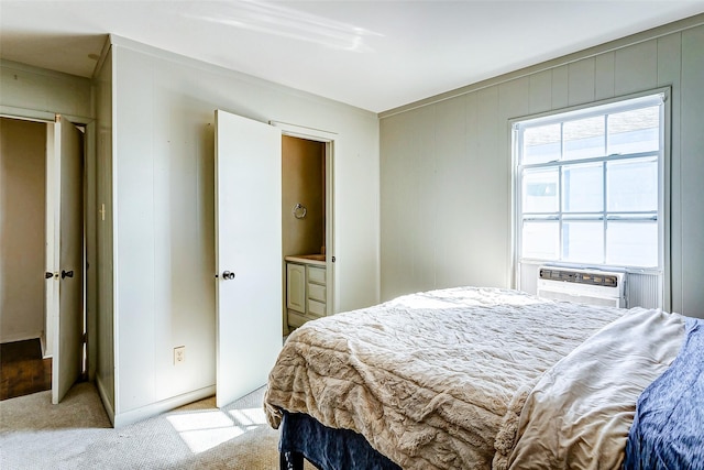 bedroom with light carpet and cooling unit