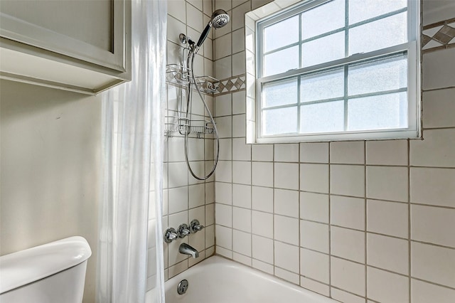 bathroom with toilet and shower / bathtub combination with curtain