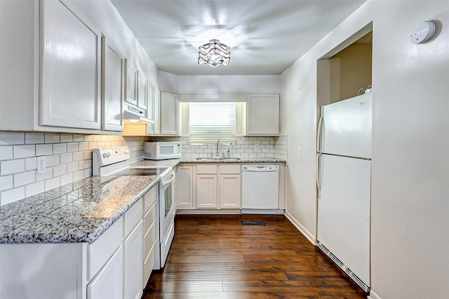 kitchen featuring dark hardwood / wood-style flooring, white appliances, white cabinetry, and sink